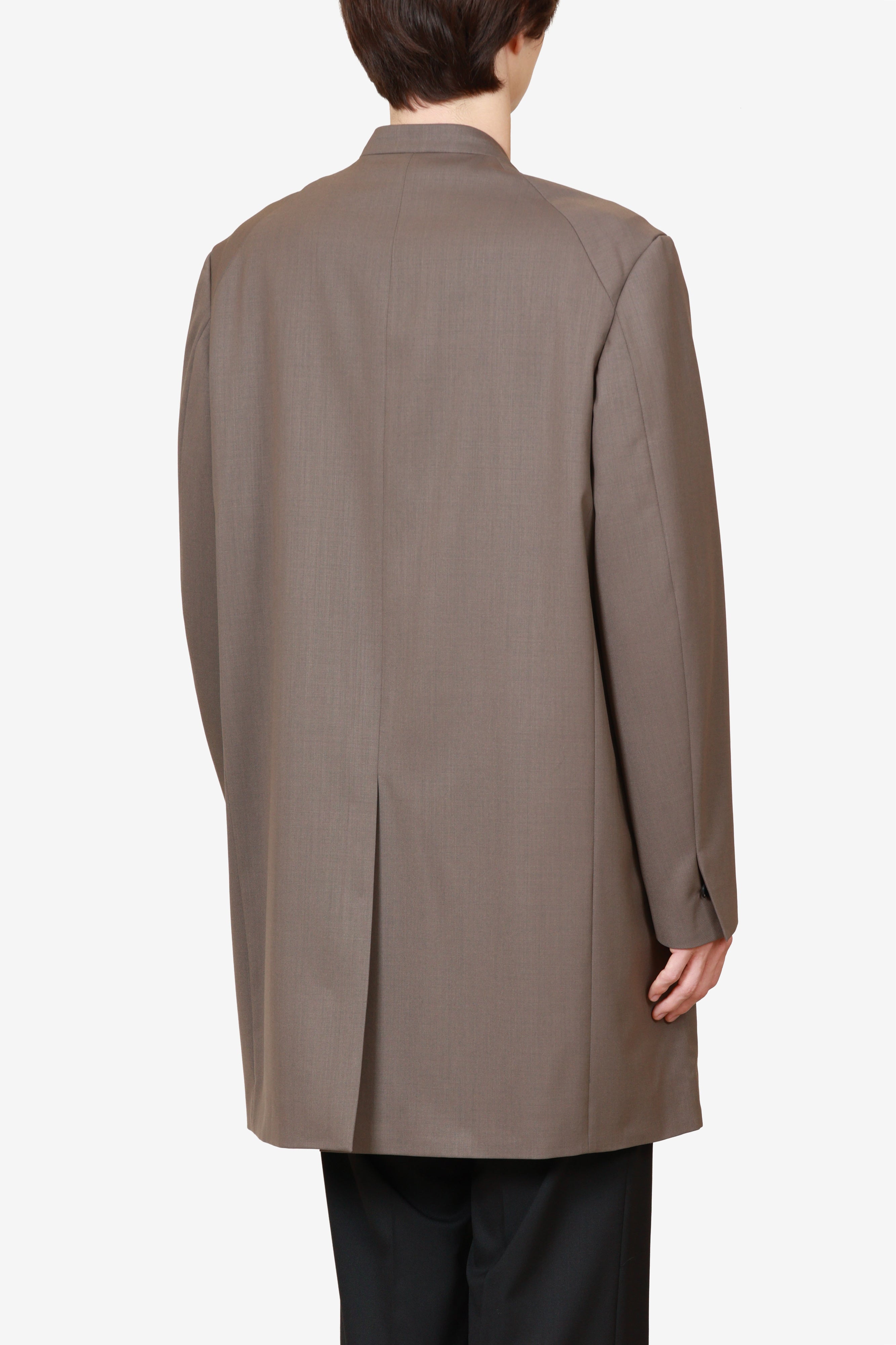 限定商品 AC52-120 ウール/ポリエステルストレッチギャバジン ノーカラーロングジャケット